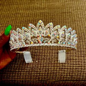 Silver and rhinestone tiara never worn. 18 in circumference